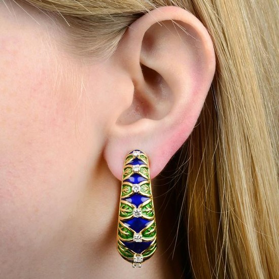 A pair of diamond and enamel hoop earrings.Estimated