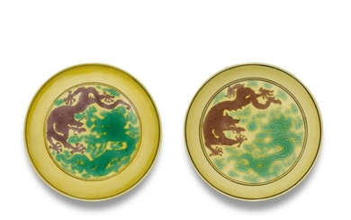 A pair of green and aubergine-enamlled yellow-ground 'dragon' dishes, Marks and period of Kangxi | 清康熙 黃地紫綠彩雙龍趕珠紋盤一對 《大清康熙年製》款, A pair of green and aubergine-enamlled yellow-ground 'dragon' dishes, Marks and period of Kangxi | 清康熙 黃地紫綠彩雙龍趕珠紋盤一對 《大清康熙年製》款