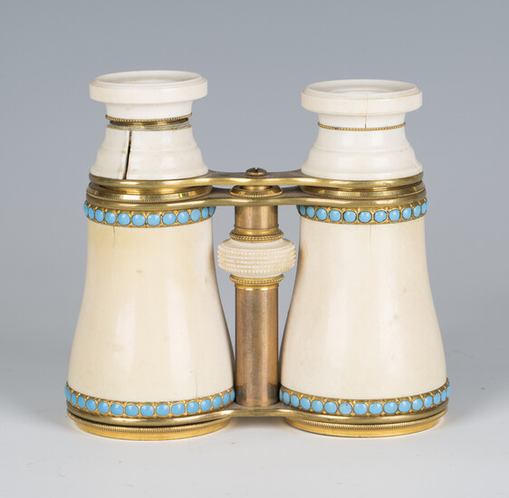 A pair of late 19th century French gilt lacquered brass and ivory opera glasses, each ivory barrel d