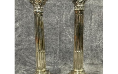 A pair of sterling silver candle holders in collumn form, ha...