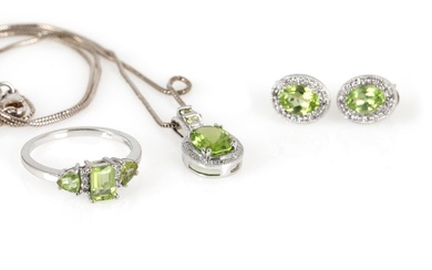 A peridote and diamond jewellery set comprising a ring set with an...
