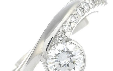 A platinum brilliant-cut diamond dress ring.Principal