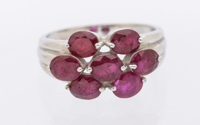 A ruby and 9ct white gold cluster ring, comprising seven...