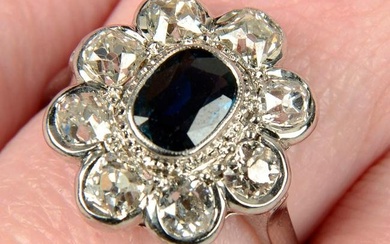 A sapphire and old-cut diamond cluster ring.Sapphire calculated weight 0.82ct, based on estimated
