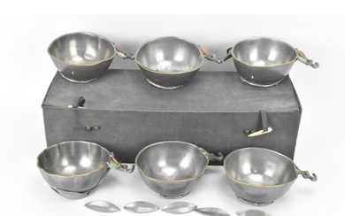 A set of six Chinese pewter bowls, each having a shaped rim ...