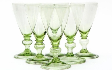 A set of six green crystal wine glasses