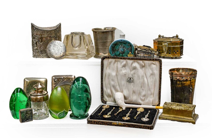 A tray of assorted silver, metalware, and glass, including...