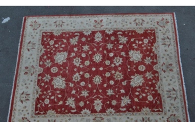 A vintage 20th century English carpet floor rug. With floral...