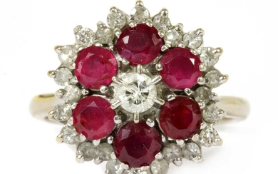 A white gold diamond and ruby target cluster ring