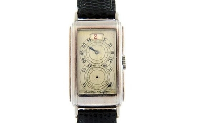 ALPINA-GRUEN - a jump hour wrist watch. White metal case, stamped 0,900 with poincon. Case width