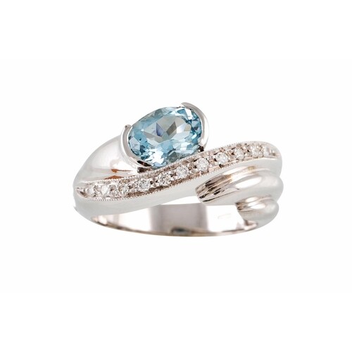 AN AQUAMARINE AND DIAMOND RING, of twist design, set with an...