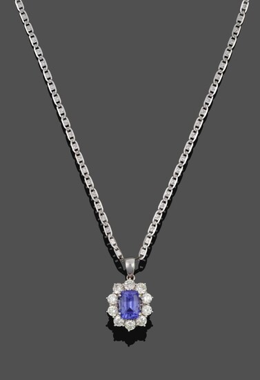 An 18 Carat White Gold Tanzanite and Diamond Cluster Pendant on Chain, the cushion cut...