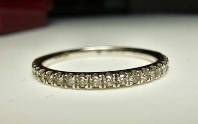 An 18ct white gold half eternity ring inset with approx 20 d...