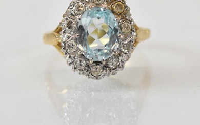 An 18ct yellow gold aquamarine and diamond set cluster ring,...