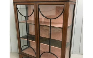 An Edwardian, inlaid mahogany, glazed bookcase with two inte...