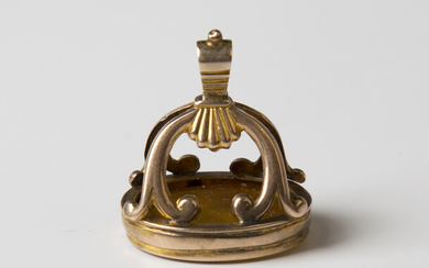An early 19th century gold mounted honey coloured agate fob seal, engraved with a profile bust portr