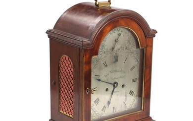 An early 19th century mahogany case table clock by William Nicoll Junior. H. 38 cm.