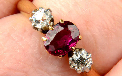 An early 20th century 18ct gold ruby and old-cut diamond three-stone ring.