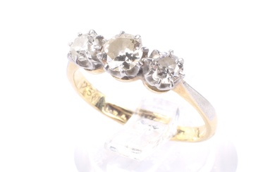 An early 20th century gold and diamond three stone ring. The graduated old-cut stones approx. 0.