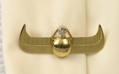 An engraved and textured scarab brooch, with old-cut diamond collet highlight, signed C. Burger.