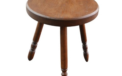 An oak milking stool, tripod base with turned legs, 33 by 36...