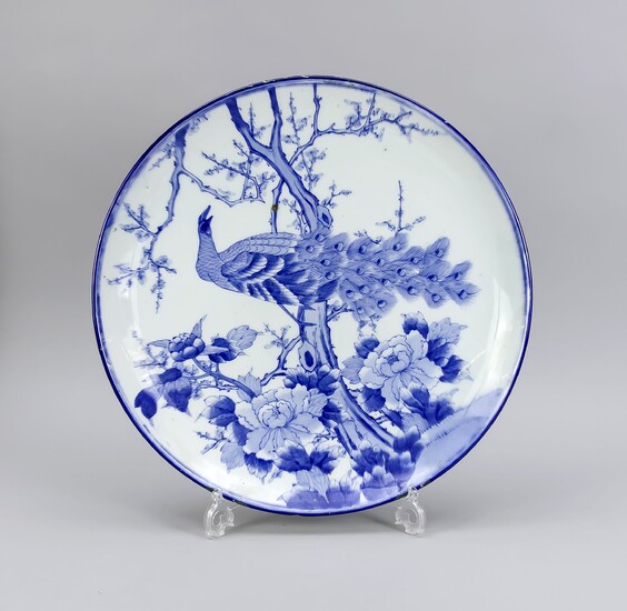Blue-white plate/bowl with peacock, China, 20th cent. Underside of banner with tendril, bottom with remains of colour and silicone, D. 47 cm