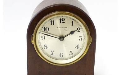 Bulle - Clock : A French Art Deco mahogany cased electric ma...