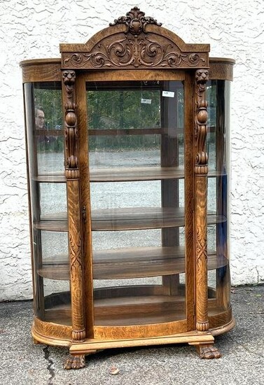 Carved Oak China cabinet with bow side.
