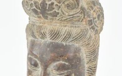 Carved stone head of a buddhist divinity, probably Kuan