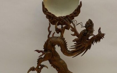 Carved wooden dragon. Chinese work. Height: 120 cm.
