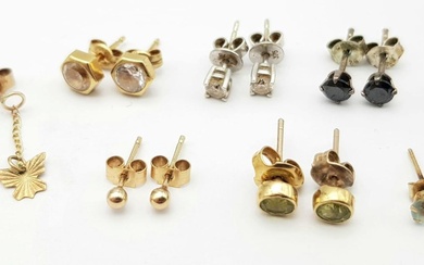 Eight pairs of 9 K yellow gold stud earring...