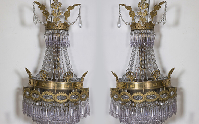 Elegant pair of Empire style wall lights in gilt bronze and glass. Ornamented with palmettes, laureate fretwork, beads and pandelocas and prisms. Height: 78 cm. Exit: 900uros. (149.747 Ptas.)