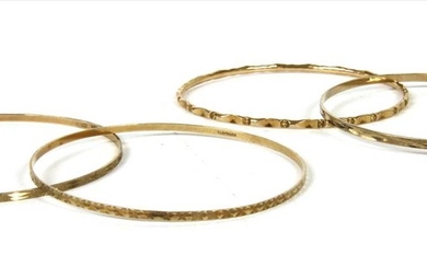 Four 9ct gold bangles