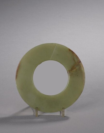 HUMAN TYPE DISC made of celadon jade-nephrite with rust veins.