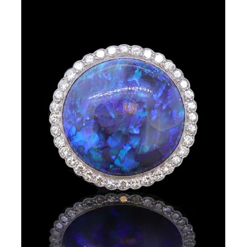 IMPORTANT BLACK OPAL AND DIAMOND CLUSTER RING, set with a ro...