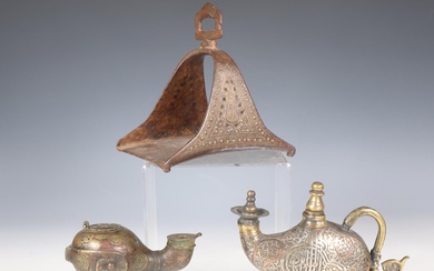 Iran, a metal horse shoe stirrup, a bronze oillamp and a bronze water sprinkler highlighted with silvered and copper texts, 18th-19th century.
