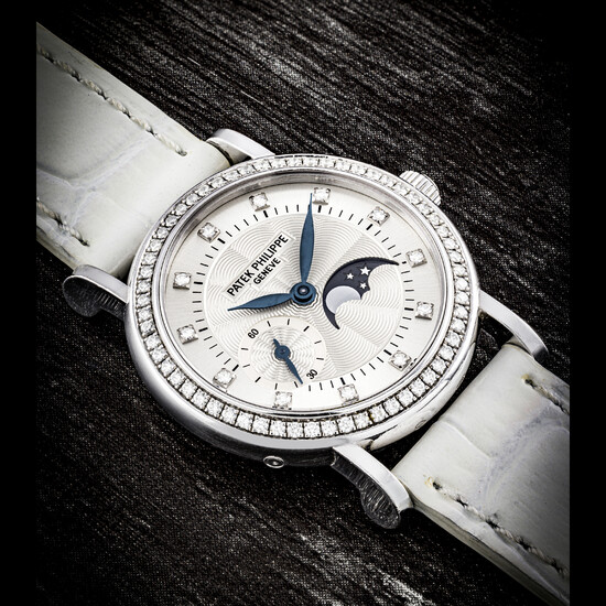 PATEK PHILIPPE. A LADY’S 18K WHITE GOLD AND DIAMOND-SET WRISTWATCH WITH MOON PHASES REF. 4858G, MANUFACTURED IN 2005
