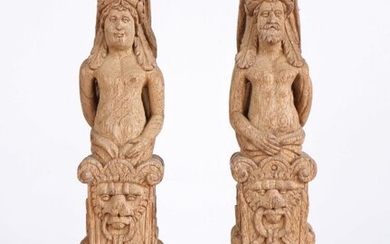 Pair of 17th Century carved oak terms, depicting a male and female figure mounted on a lion's face