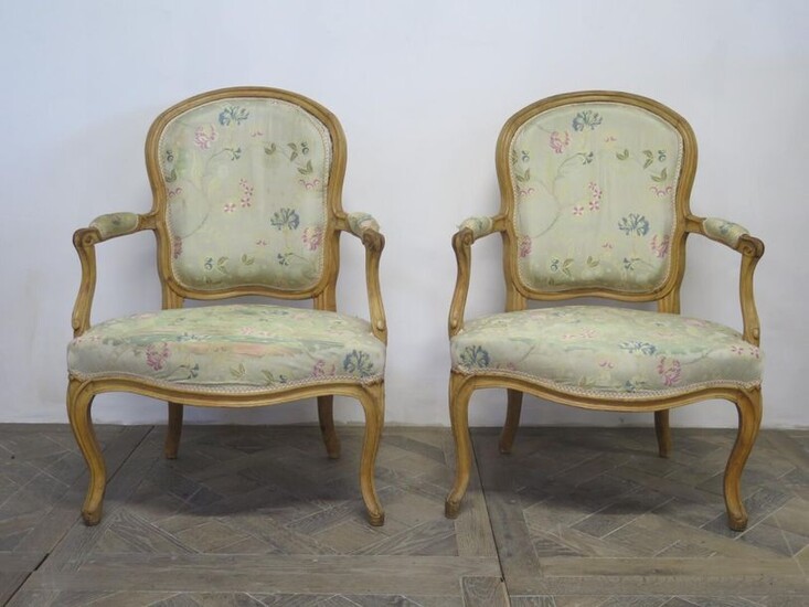 Pair of armchairs in moulded and carved wood, formerly lacquered.