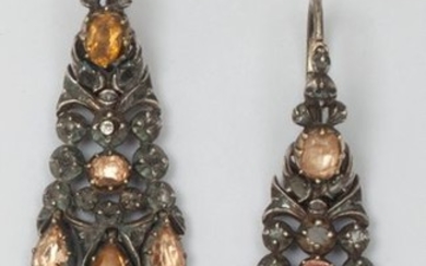 Pair of supple silver earrings with yellow stones...