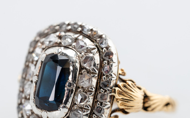 Ring with sapphire and diamonds.