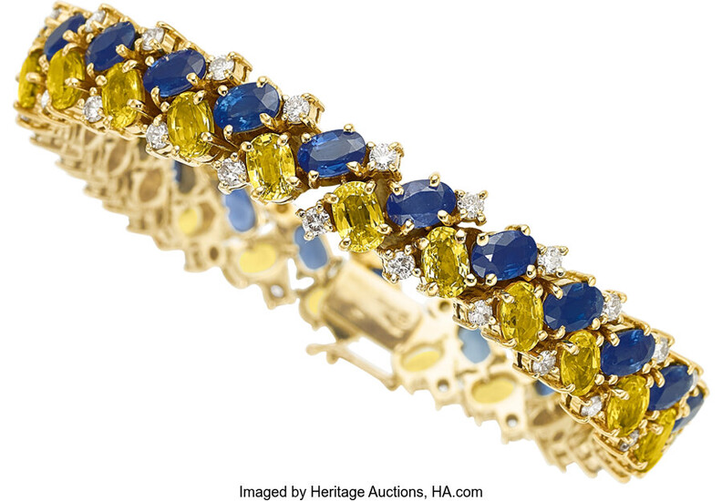 Sapphire, Diamond, Gold Bracelet The bracelet features oval-shaped blue...