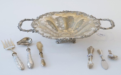 Silver-plated dish, with floral decoration, 19th/20th century, one handle is loose, diam. 31 cm + Silver with steel oyster knife, 800 + Silver meat fork, 800 + Silver gravy spoon, below the legal amount + 3 meat forks + Butter knife + Silver tea tumb...