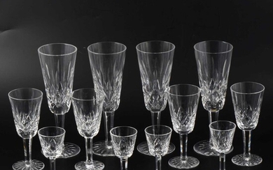 Six Waterford crystal champagne flutes, 19cm; seven sherries; and eight liqueurs, (21).