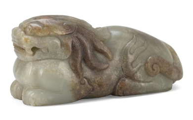 CELADON AND RUSSET JADE CARVING OF A QILIN...