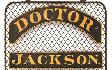 TIN AND IRON DOCTOR'S OFFICE SIGN Double-sided. "Doctor Jackson." in gold lettering on black banners mounted on a black wire frame....