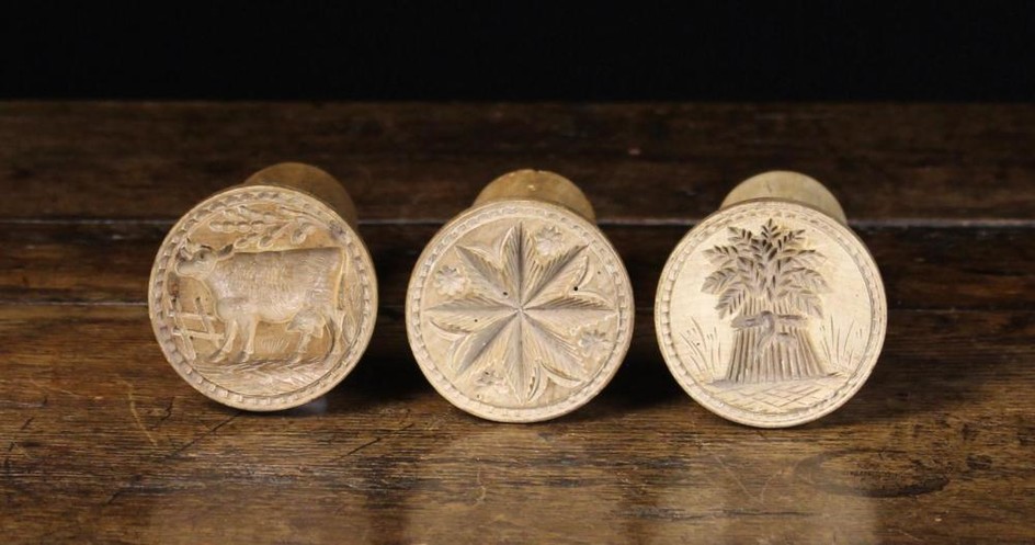 Three Carved Sycamore Butter Stamps. The round decorative moulds carved with a star & daisy heads, a