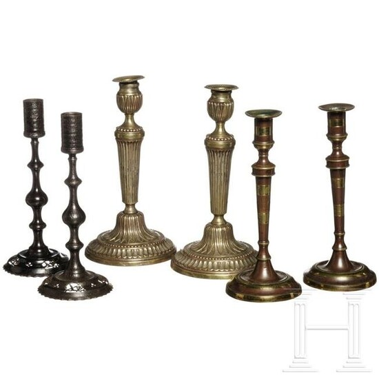 Three pairs of British and French candlesticks