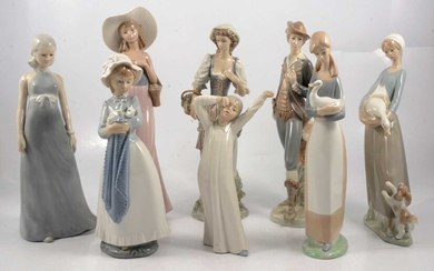 Two Lladro figures, five Nao figures, and another