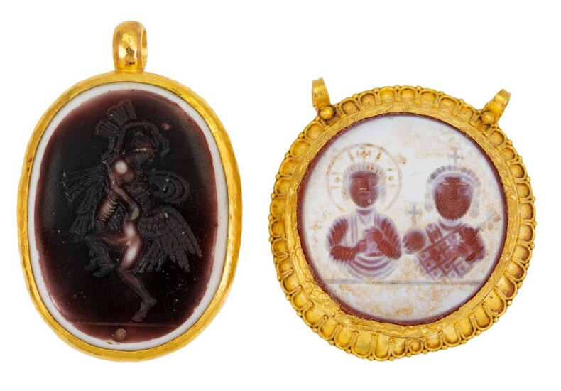 Two intaglio pendants, comprising: a circular hardstone intaglio pendant depicting the profile of a Byzantine emperor and empress, within a Byzantine revival frame; and an oval glass intaglio depicting two figures embracing, to a collet mount.
